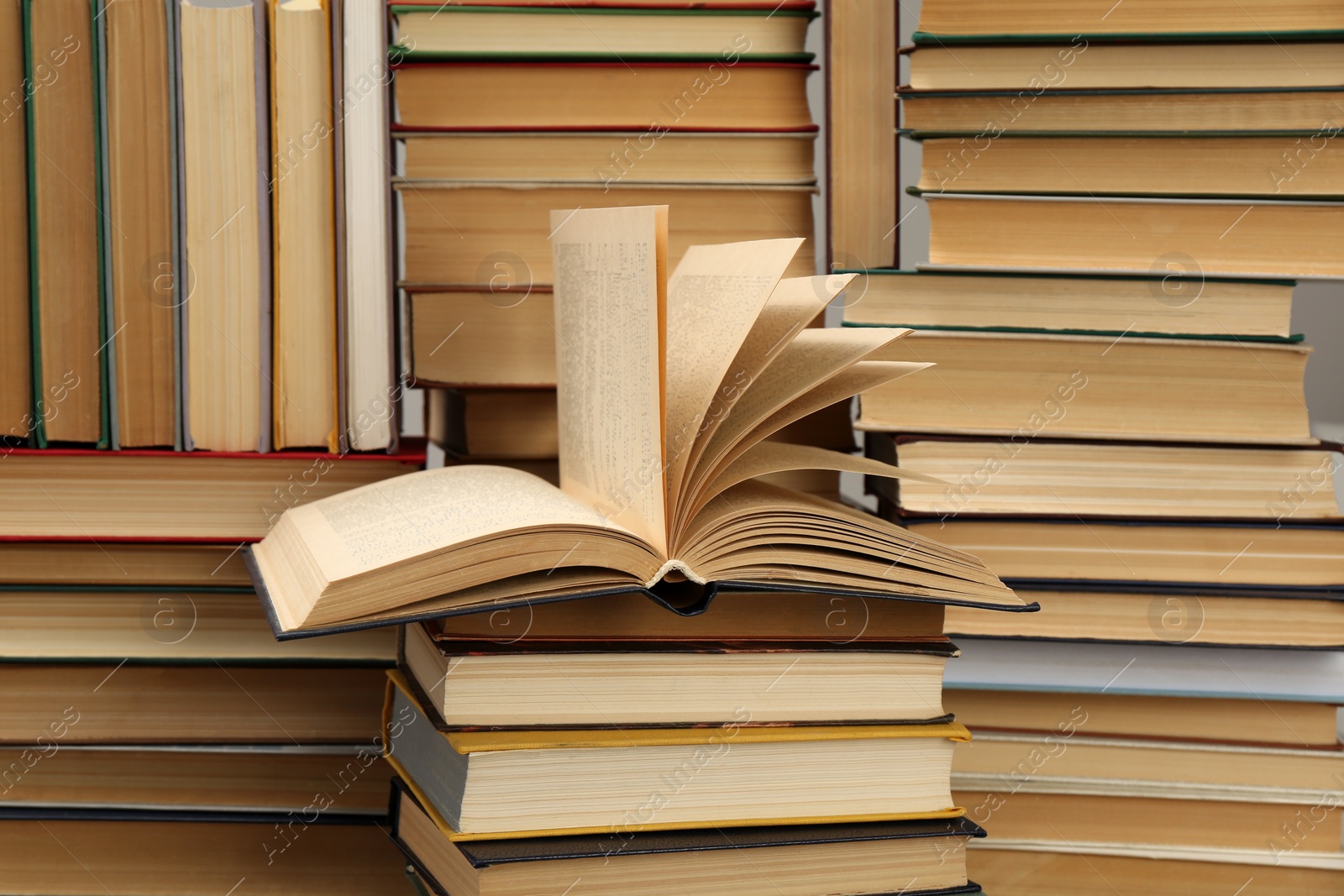 Photo of Many hardcover books as background. Library material