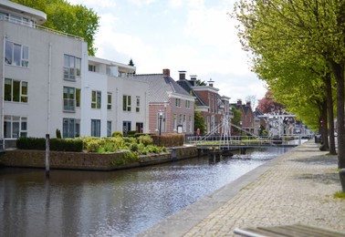 Cityscape with buildings, bridge and beautiful canal