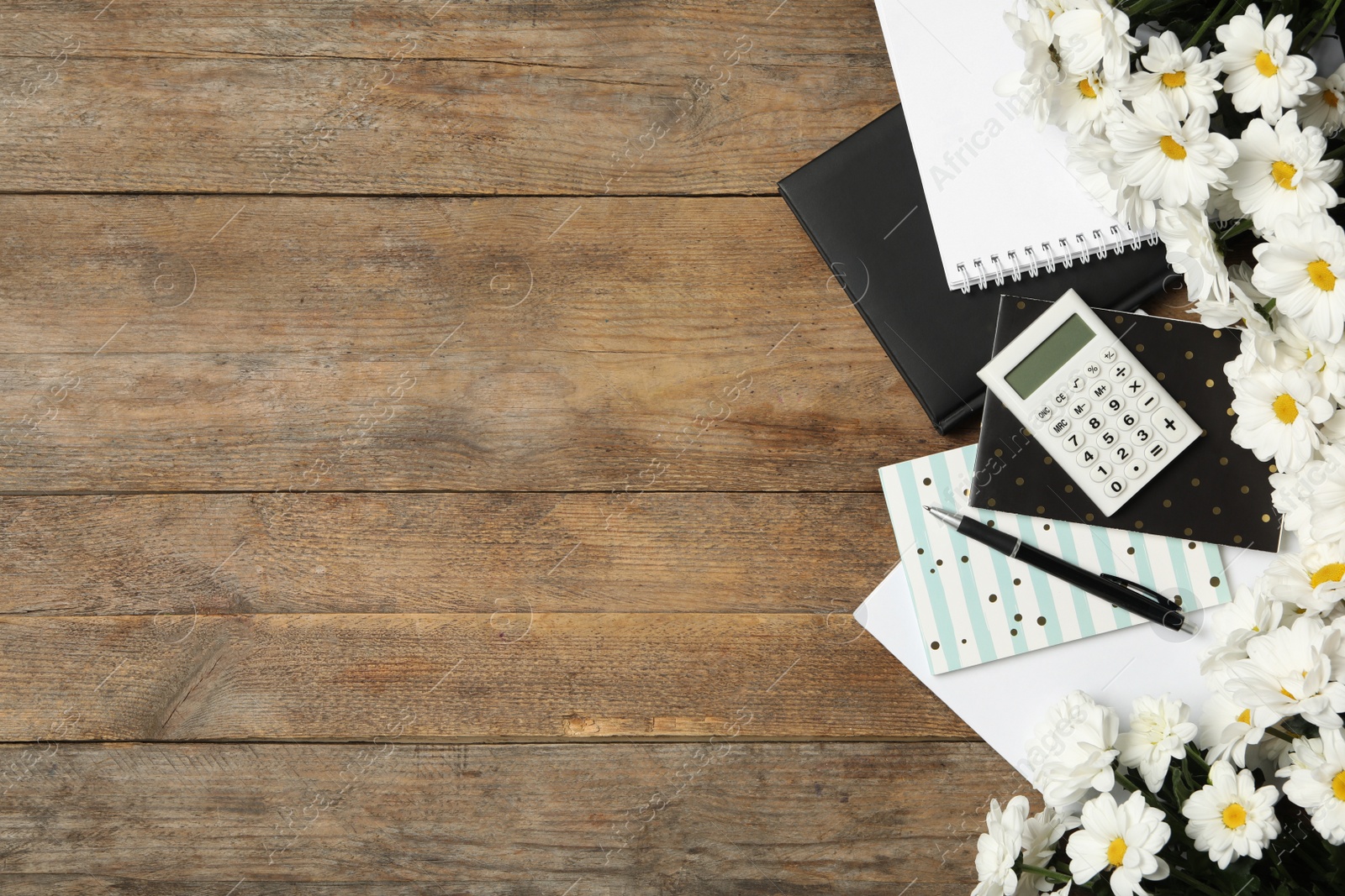 Photo of Set of stationery and flowers on wooden table, flat lay with space for text. Teacher's Day