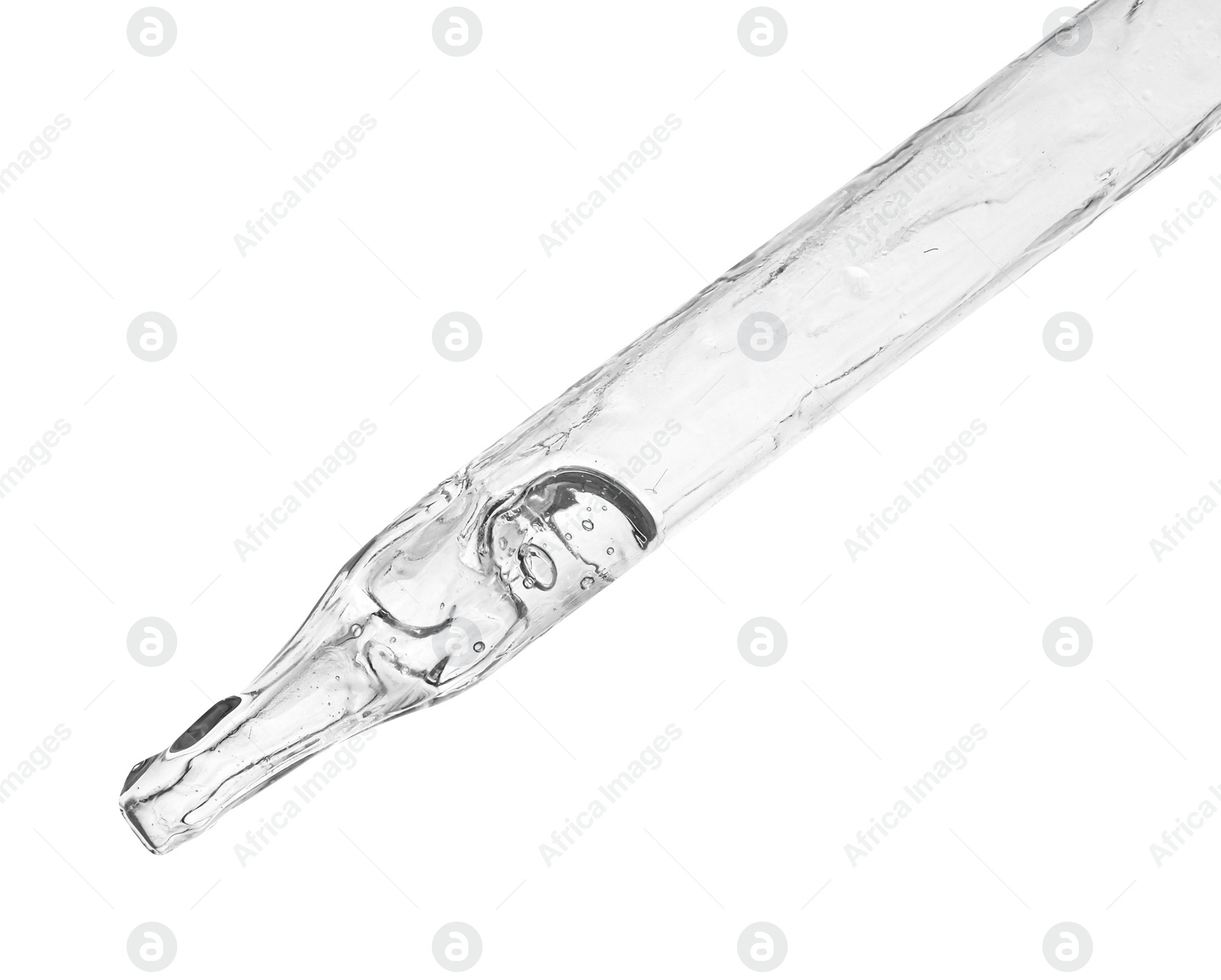 Photo of Dripping clear facial serum from pipette on white background, closeup