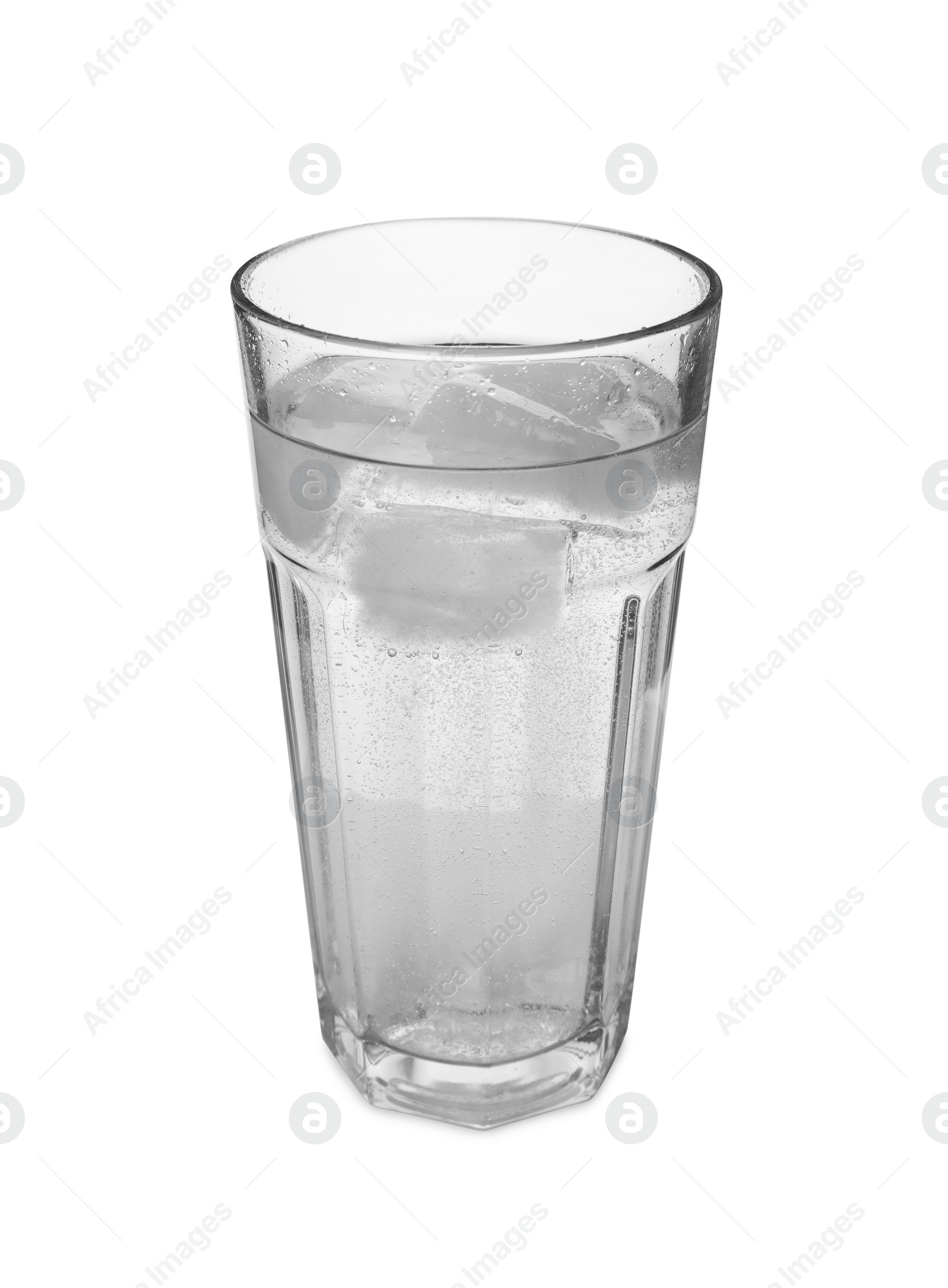 Photo of Glass of refreshing soda water with ice cubes isolated on white