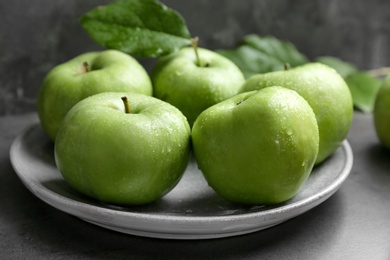 Photo of Plate with fresh green apples on table, closeup