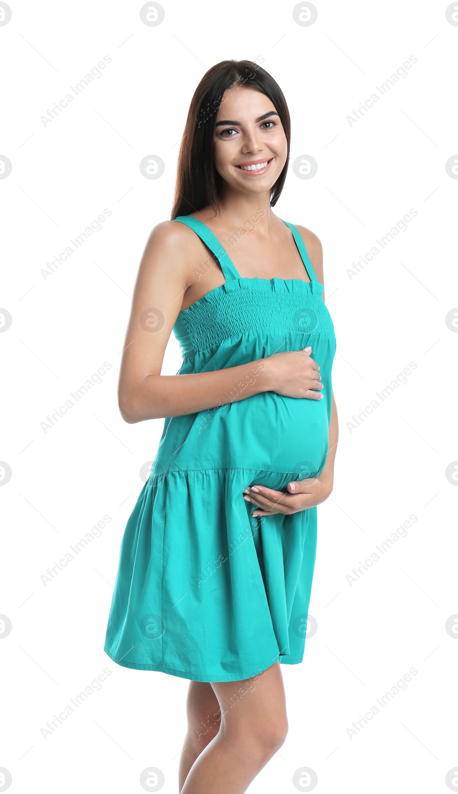 Photo of Happy pregnant woman holding her belly on white background