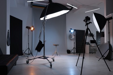 Photo of Casting call. Chair and different equipment in modern studio