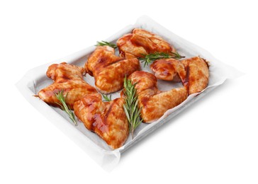 Raw marinated chicken wings and rosemary isolated on white