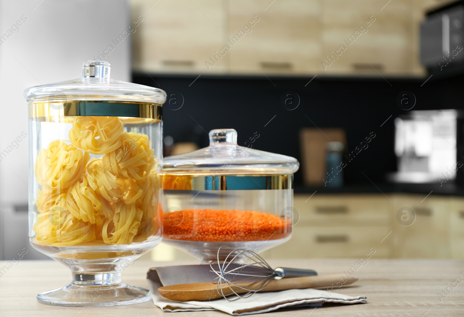 Photo of Products on wooden table in modern kitchen