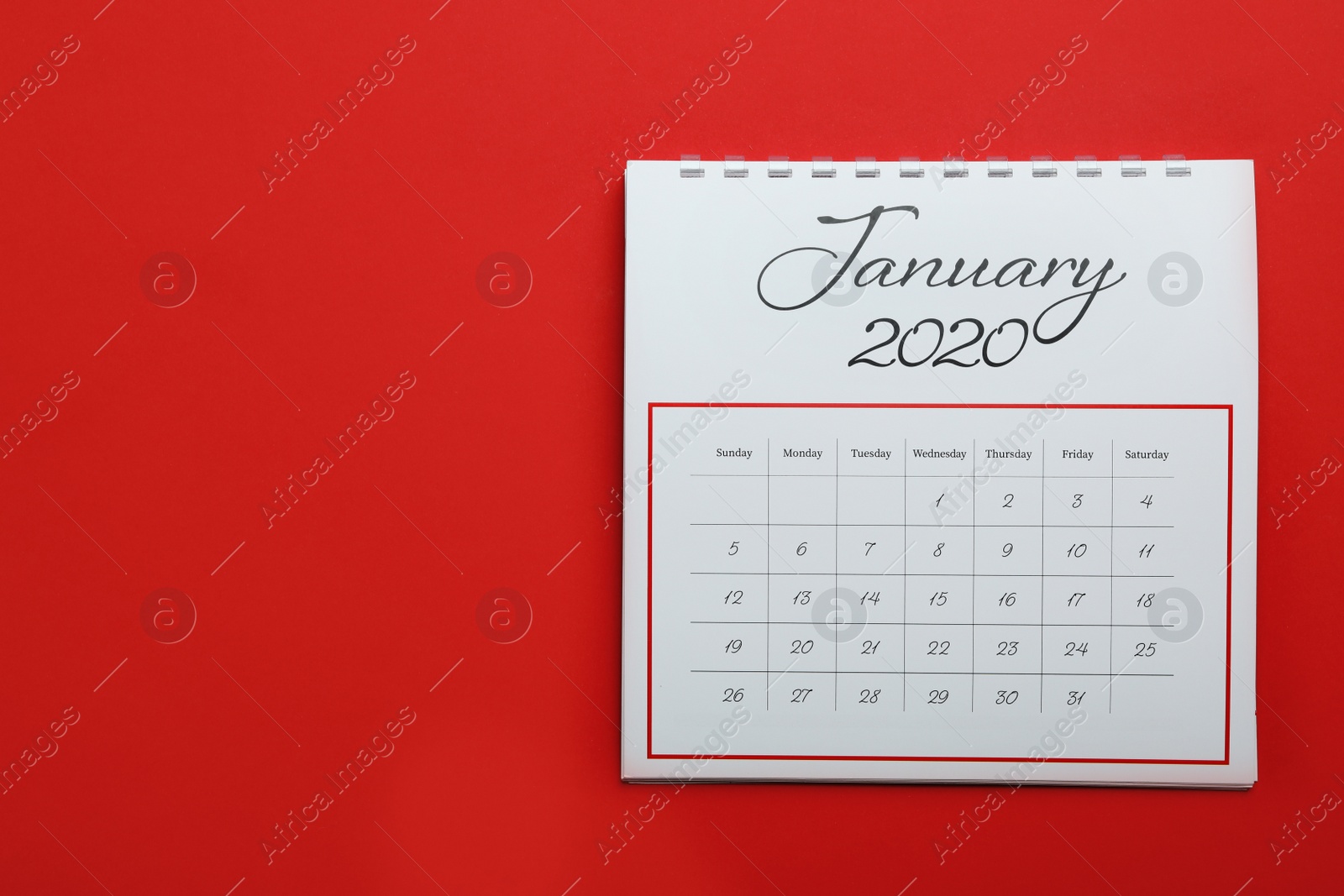 Photo of January 2020 calendar on red background, top view. Space for text