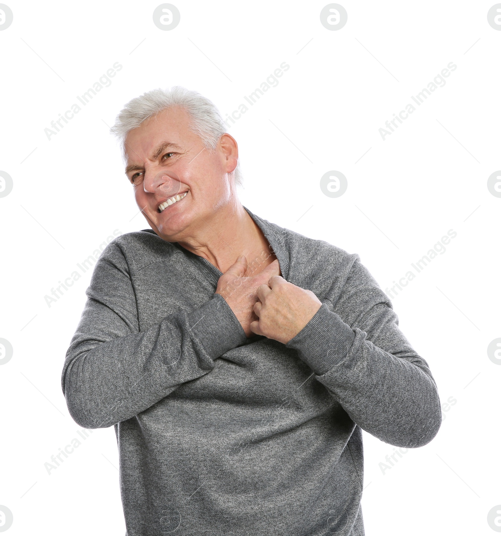 Photo of Mature man scratching chest on white background. Annoying itch