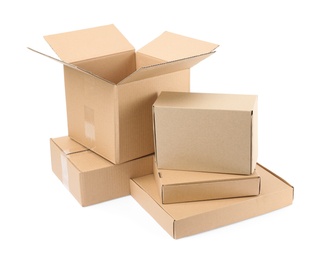 Photo of Pile of cardboard boxes on white background