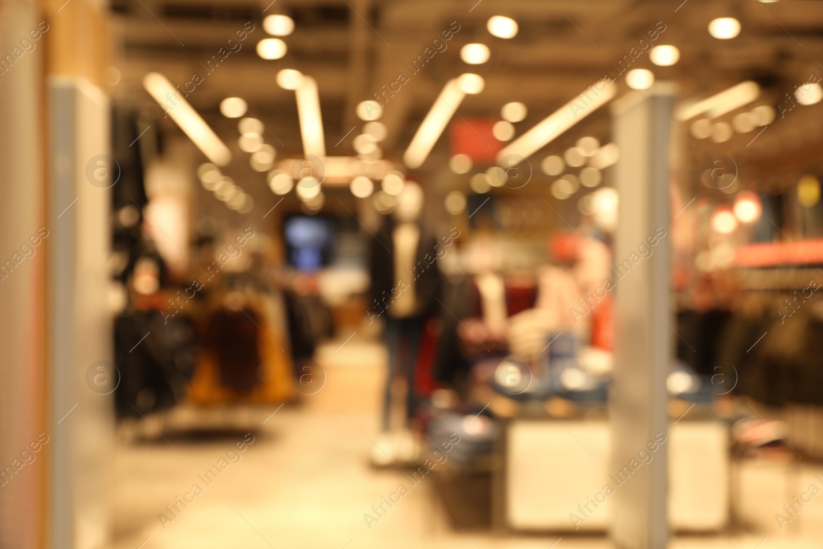 Photo of Blurred view of modern shopping mall interior. Bokeh effect