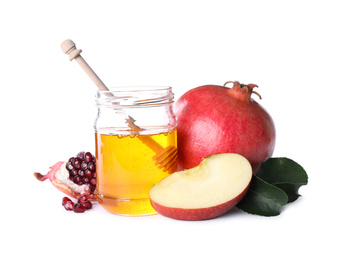 Photo of Honey, apple and pomegranate on white background. Rosh Hashanah holiday