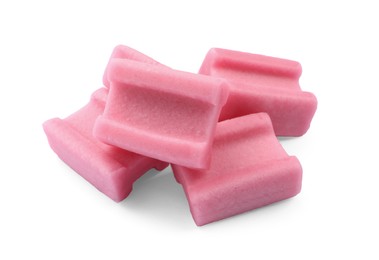 Photo of Many tasty pink chewing gums on white background