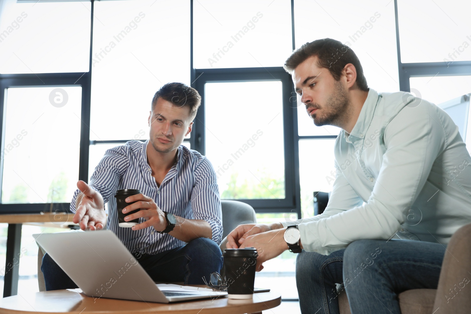 Photo of Office employees having business training at workplace