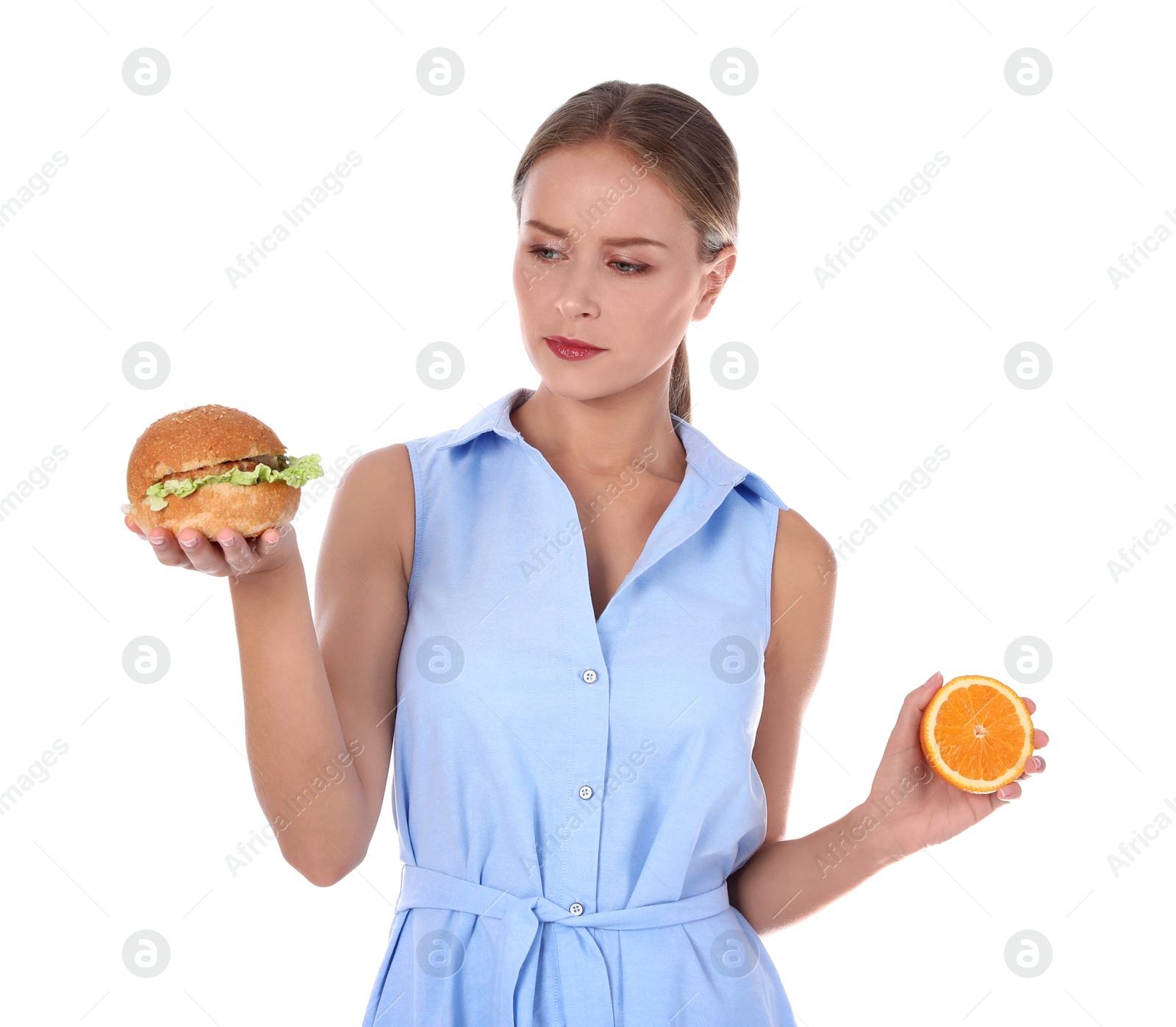 Photo of Slim woman with burger and orange on white background. Healthy diet