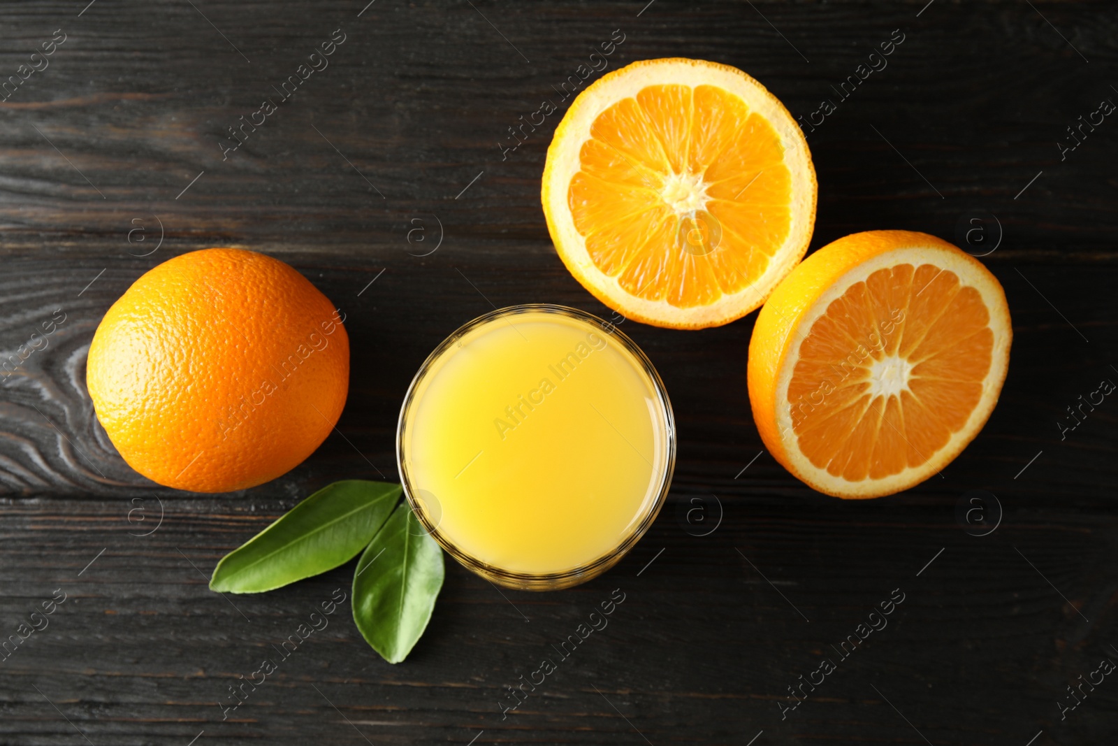 Photo of Flat lay composition with orange juice and fresh fruit on wooden background