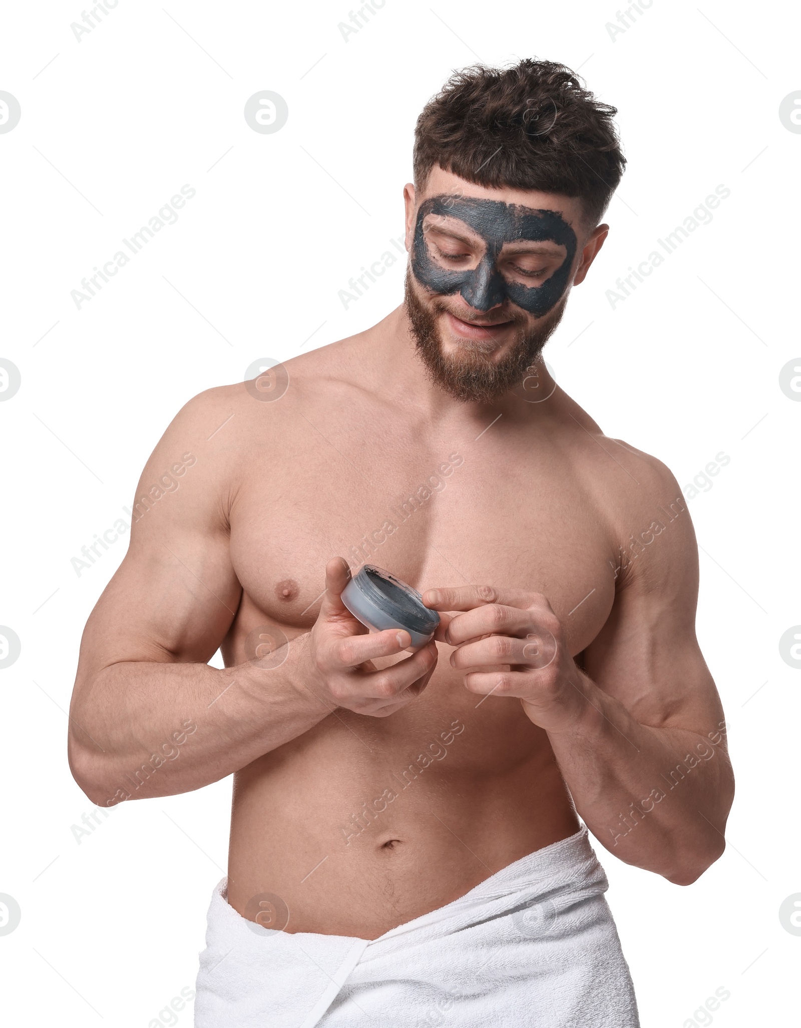 Photo of Handsome man with clay mask on his face against white background