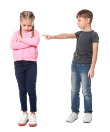 Boy pointing at upset girl on white background. Children's bullying
