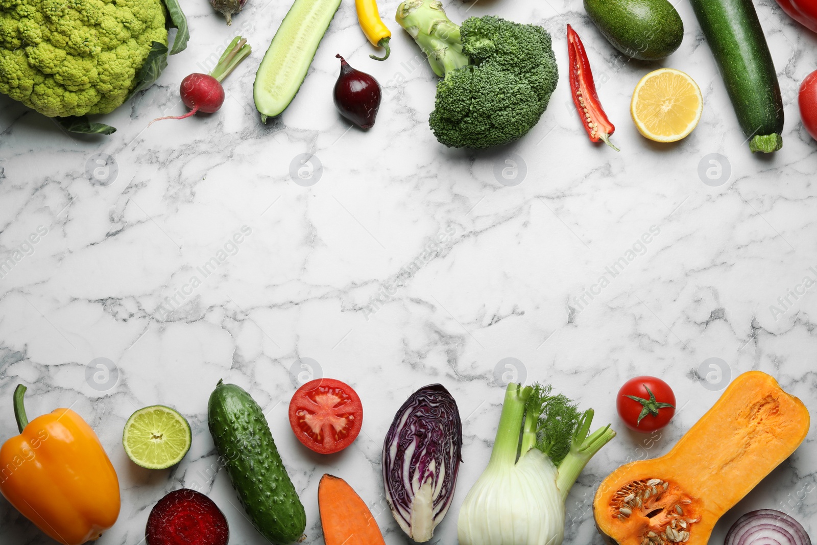 Photo of Frame made of fresh ripe vegetables and fruits on marble background, flat lay. Space for text