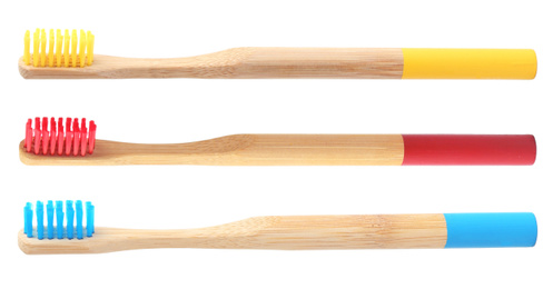 Image of Set of bamboo toothbrushes on white background 