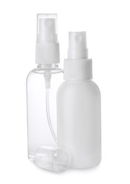 Spray bottles with antiseptic on white background