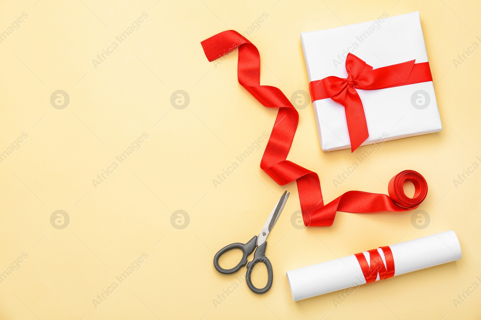 Photo of Beautiful gift box with ribbon on color background, top view