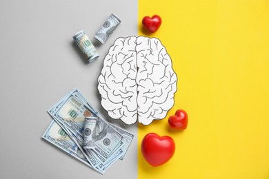 Photo of Emotional and rational. Paper human brain, dollar banknotes and red hearts on color background, flat lay