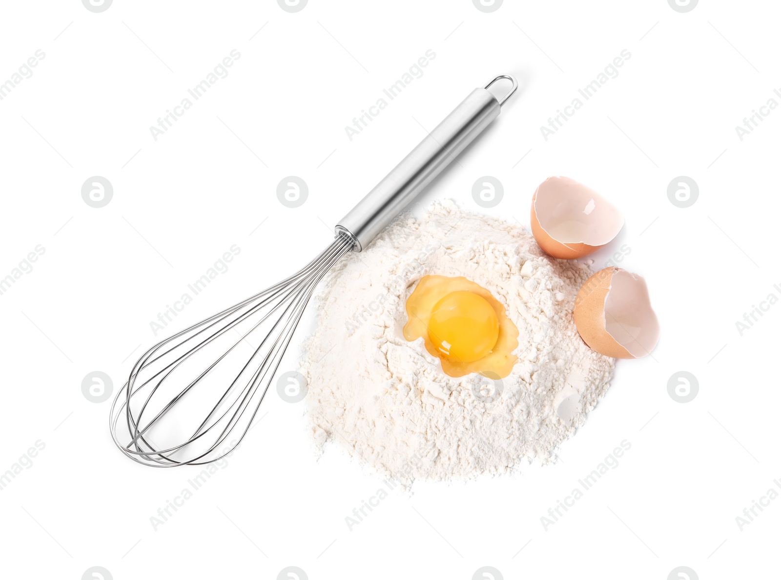 Photo of Whisk and pile of flour with egg yolk isolated on white, top view