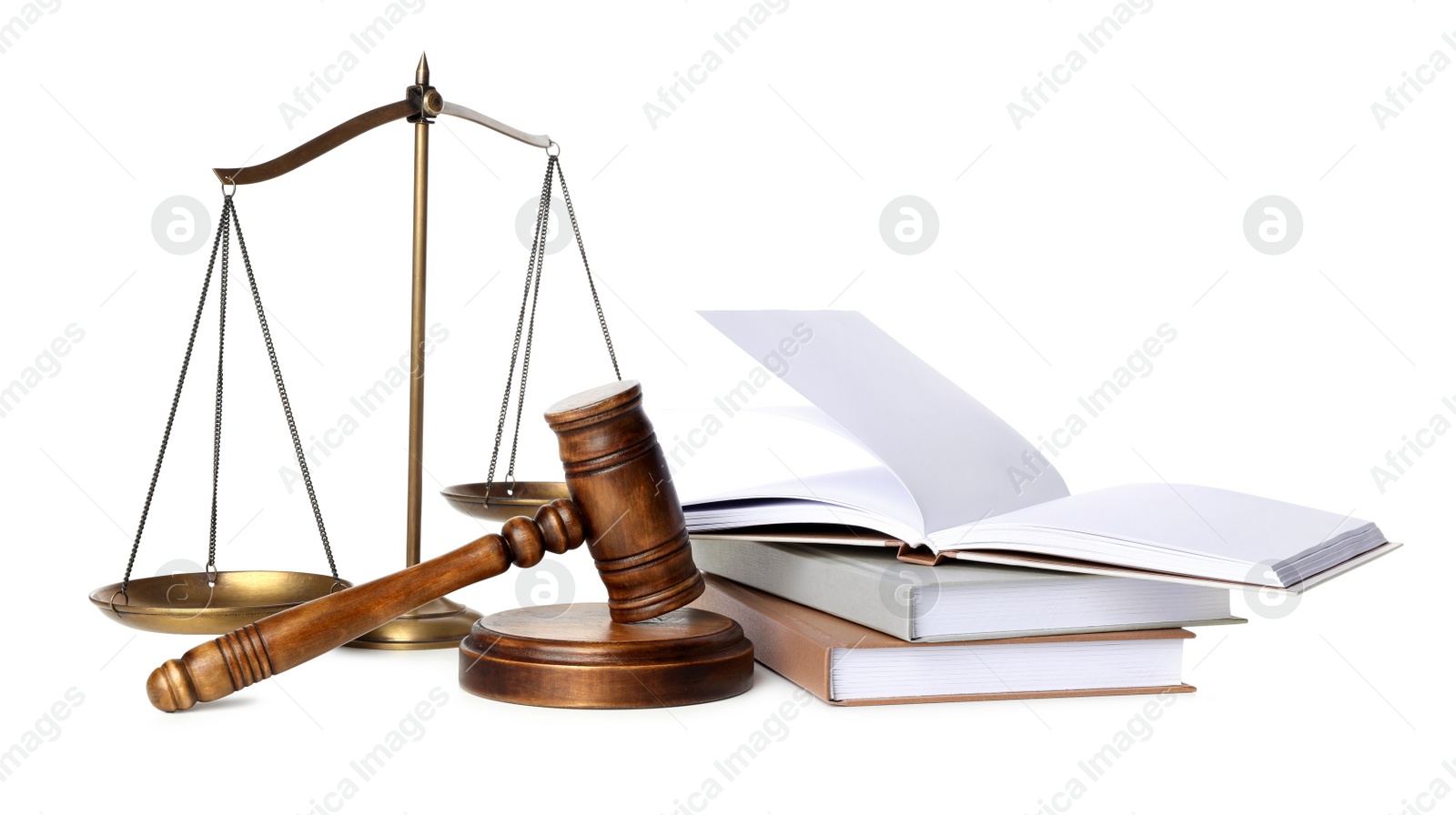 Photo of Wooden gavel, books and scales of justice on white background