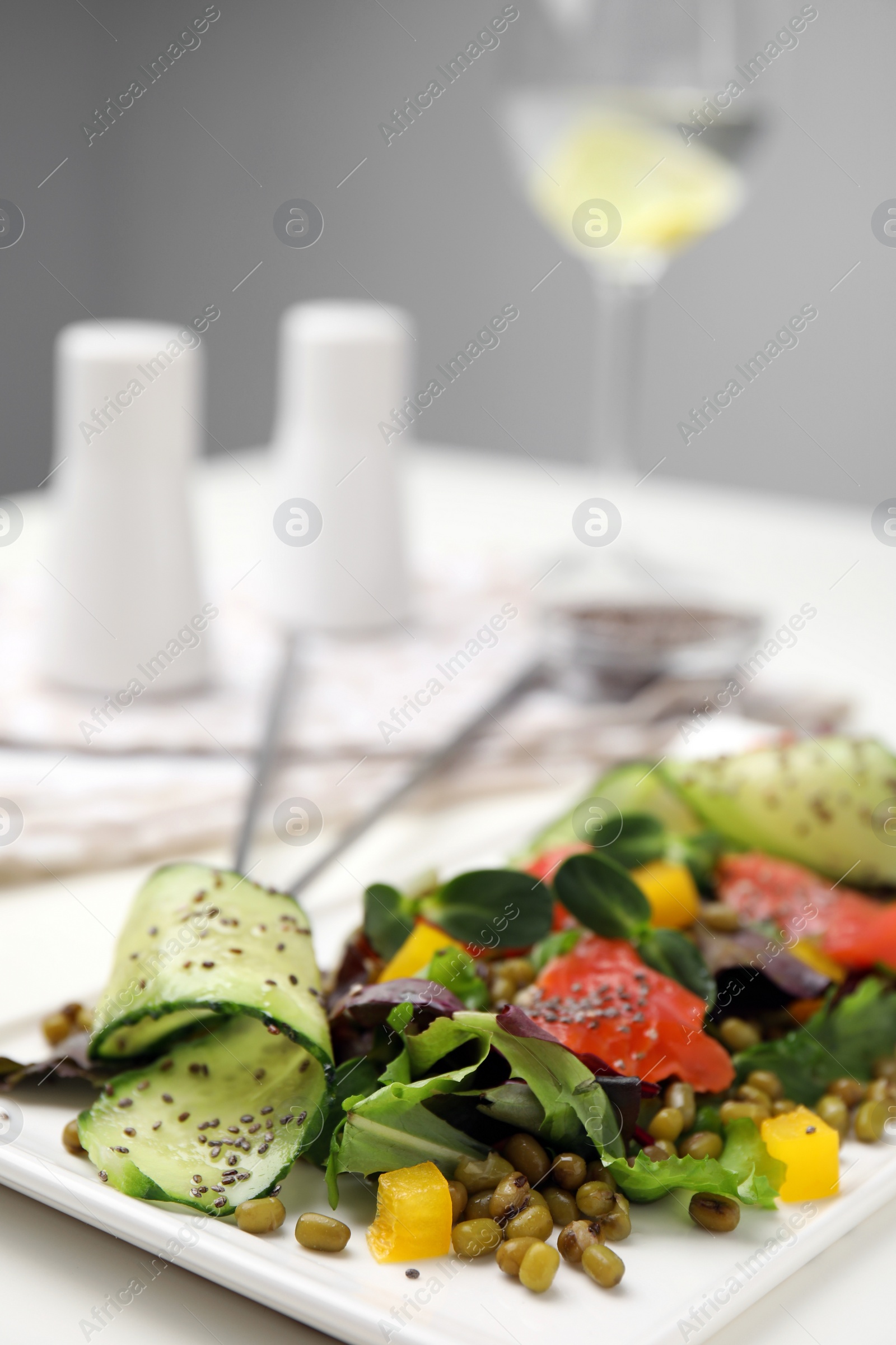 Photo of Plate of salad with mung beans on white table