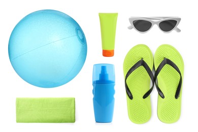 Set with beach ball and other accessories on white background