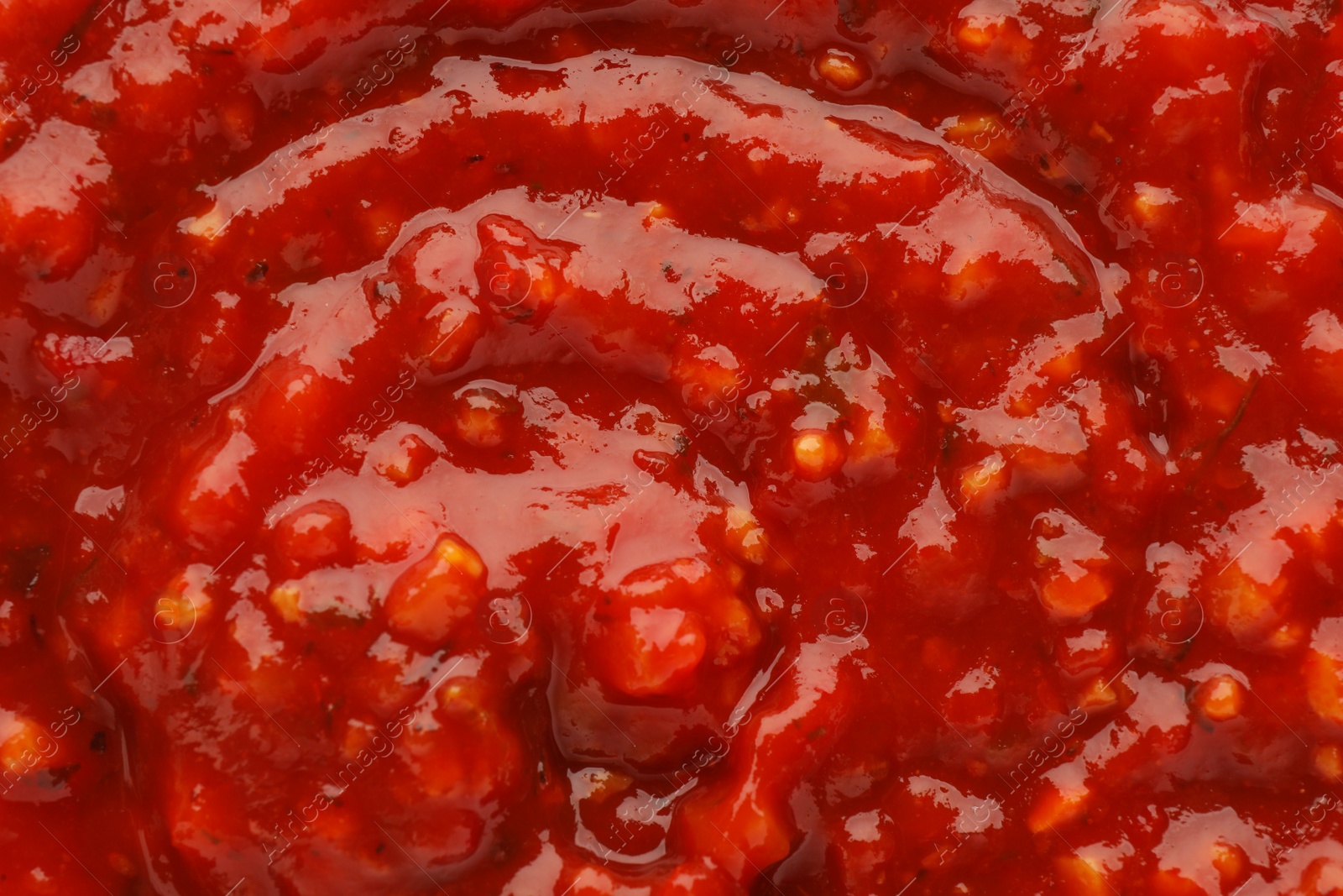 Photo of Texture of delicious adjika sauce as background, closeup