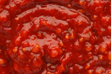 Texture of delicious adjika sauce as background, closeup