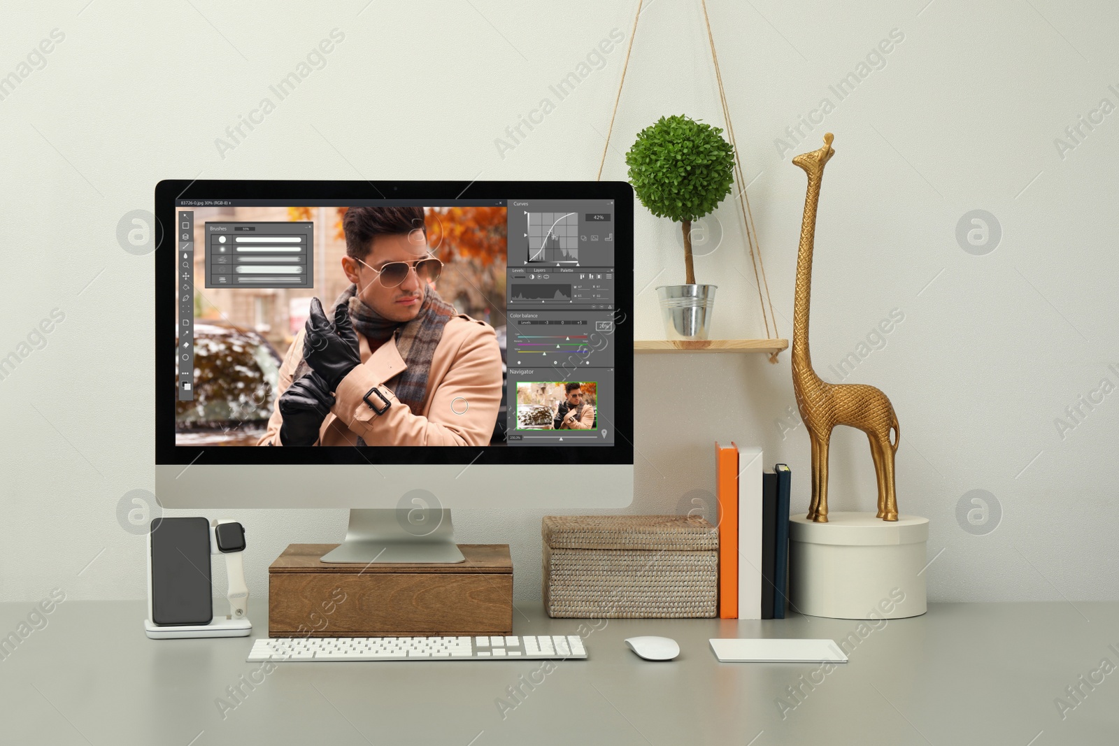 Image of Designer's workplace. Computer with photo editor application on table