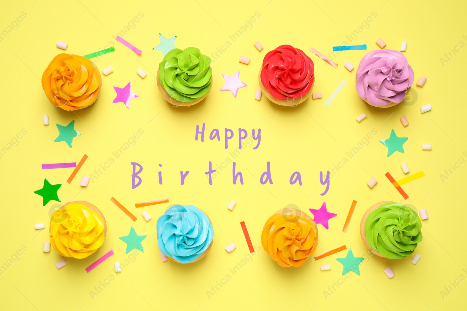 Image of Delicious cupcakes and text Happy Birthday on yellow background, flat lay