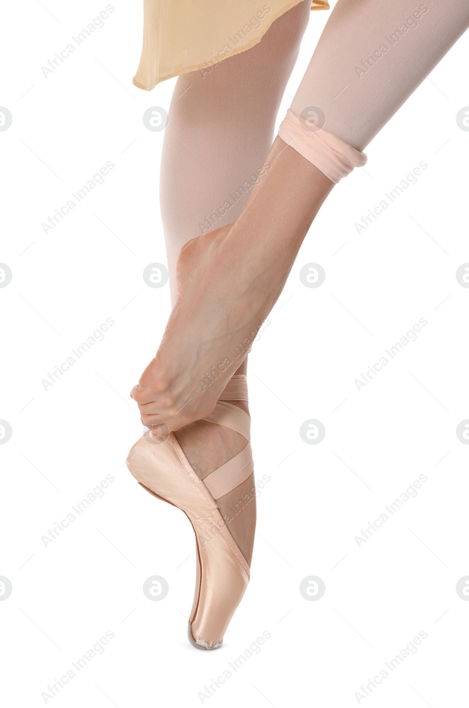 Photo of Ballerina in pointe shoe dancing on white background, closeup