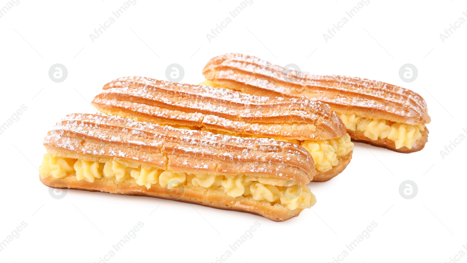 Photo of Delicious eclairs filled with cream isolated on white