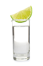 Photo of Mexican Tequila shot with salt and lime slice isolated on white