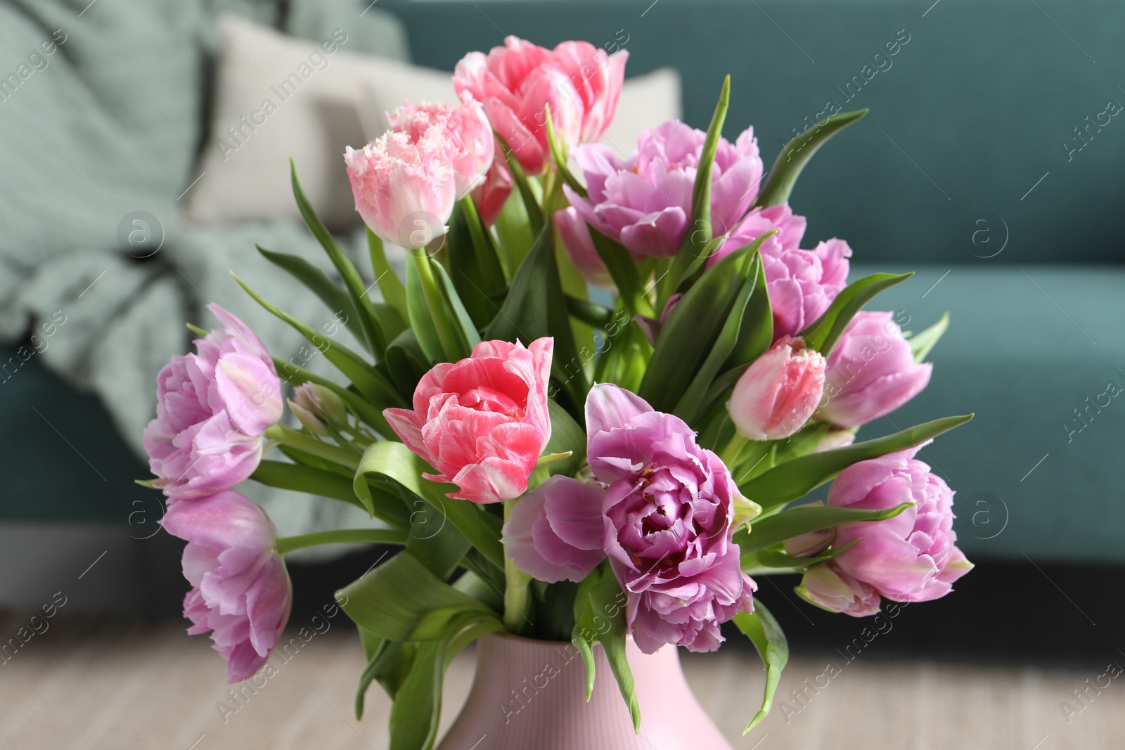 Photo of Beautiful bouquet of colorful tulip flowers indoors, closeup