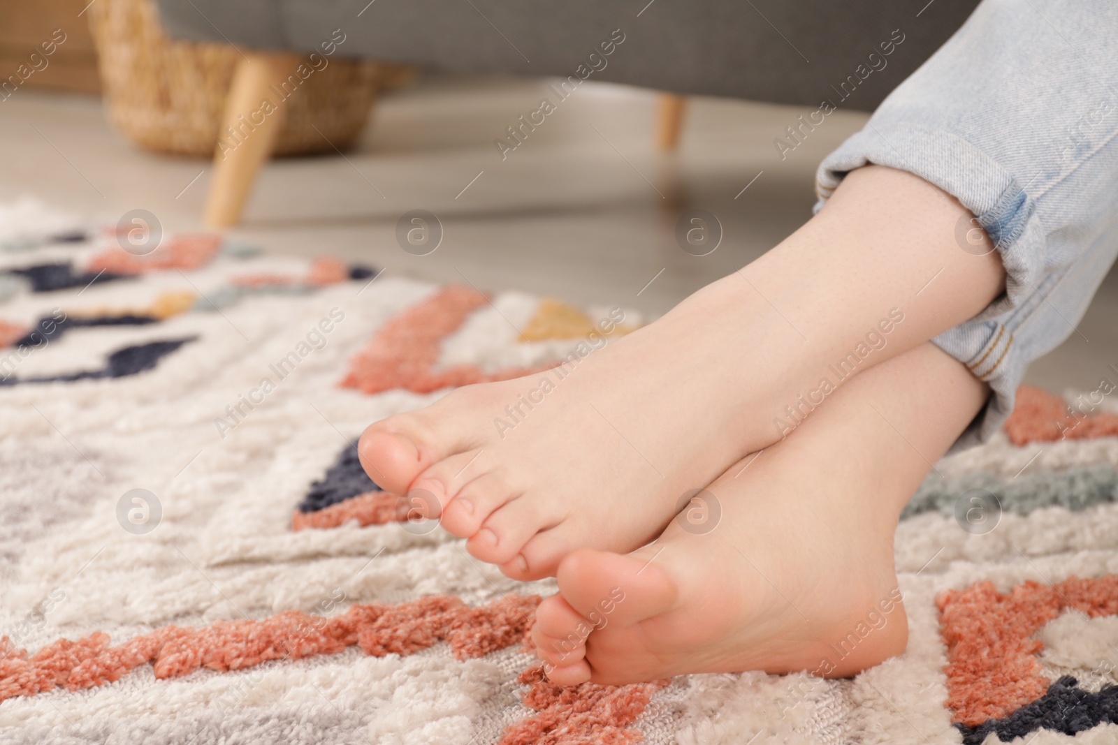 Photo of Woman sitting on sofa at home, closeup