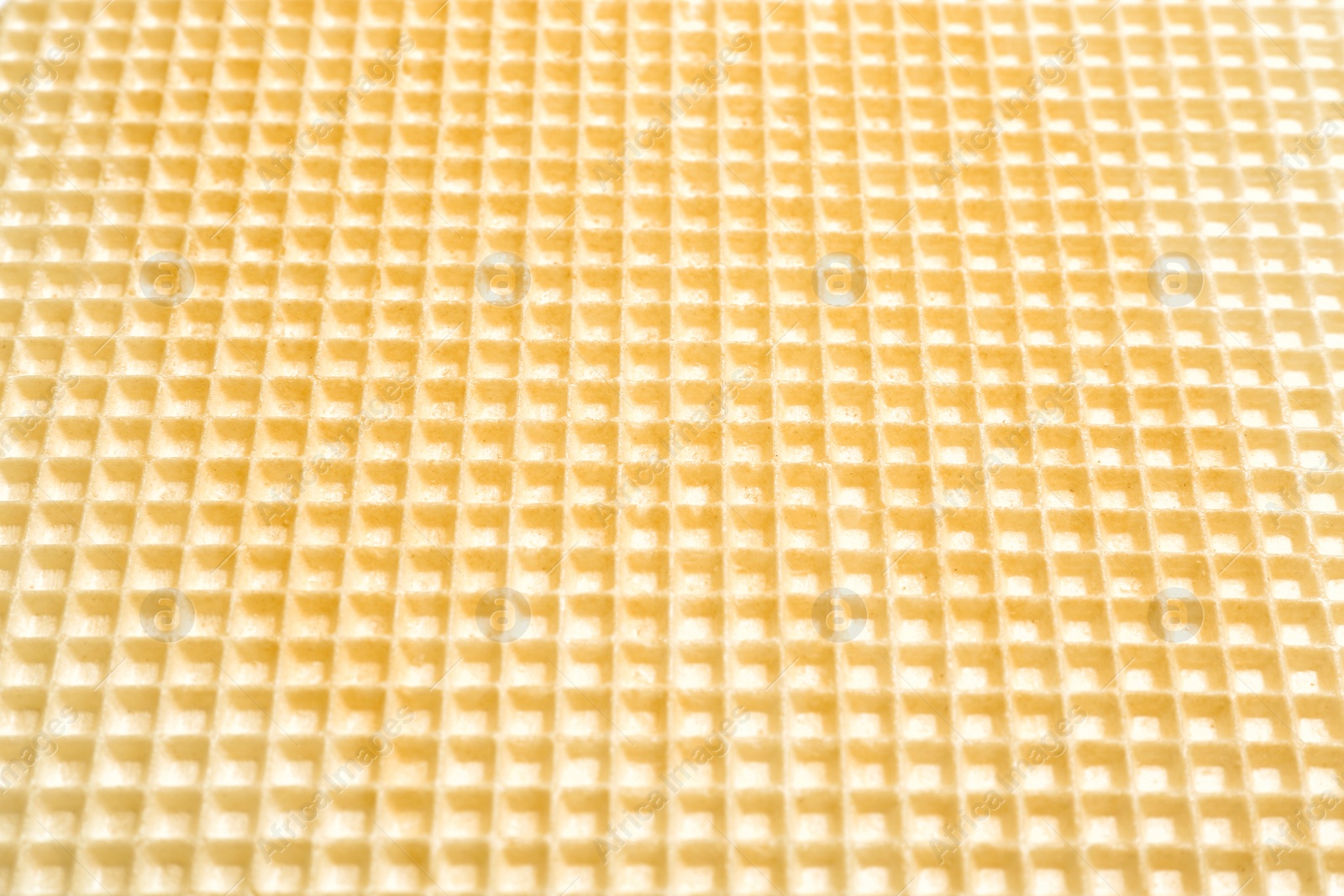 Photo of Tasty wafer as background, closeup. Crispy food