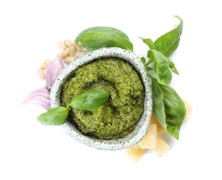 Photo of Fresh tasty pesto sauce and ingredients isolated on white, top view