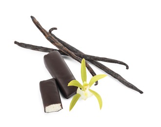 Photo of Glazed curd cheese bars, vanilla pods and flower isolated on white