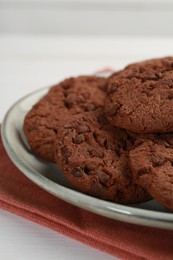 Delicious chocolate chip cookies on white table, closeup