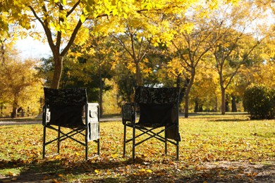 Photo of Pair of camping chairs in park on sunny day