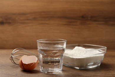 Cooking scones with soda water. Ingredients for dough on wooden table