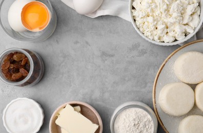 Flat lay composition with uncooked cottage cheese pancakes and different ingredients on light grey table, space for text.