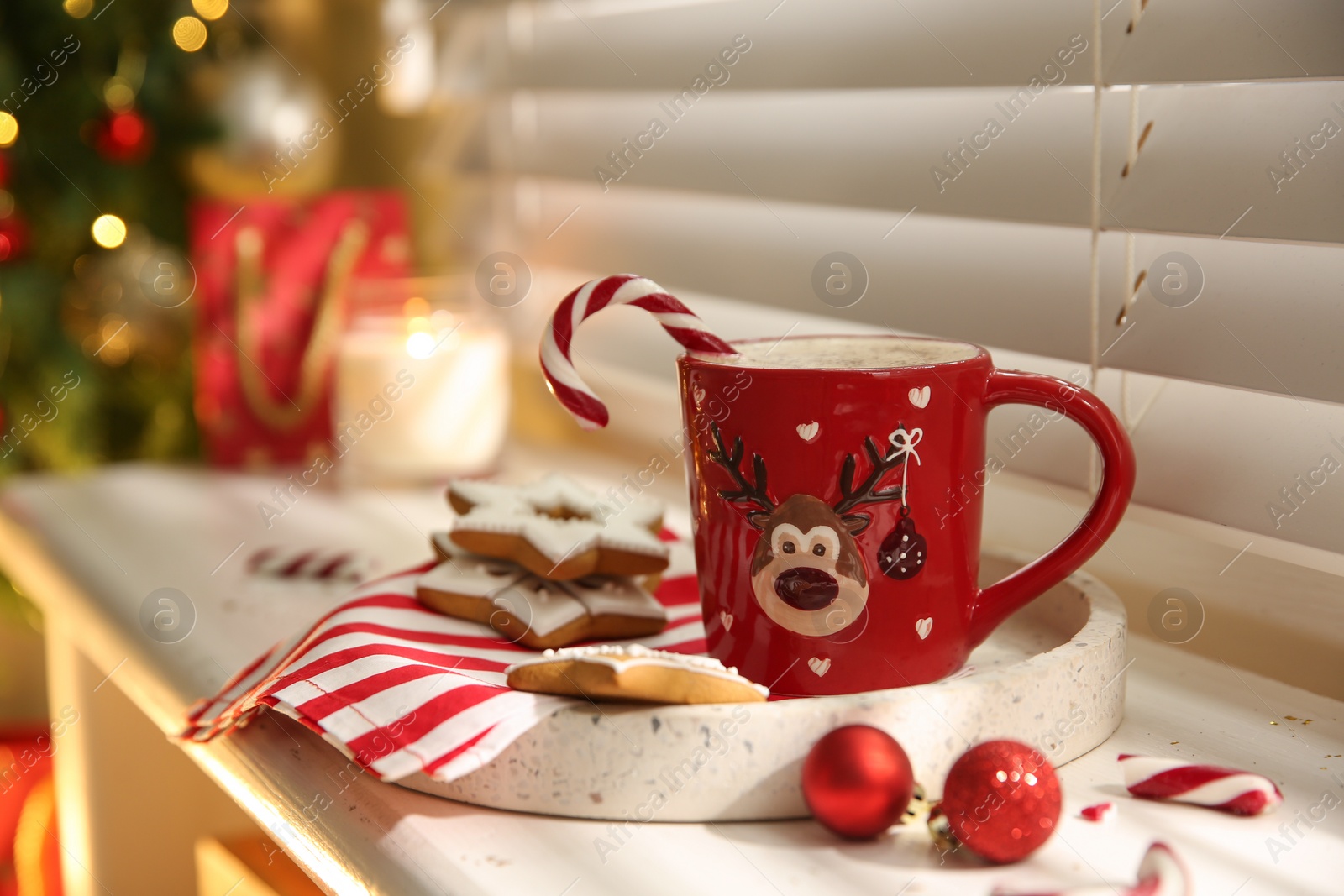 Photo of Composition with cup of hot drink on windowsill