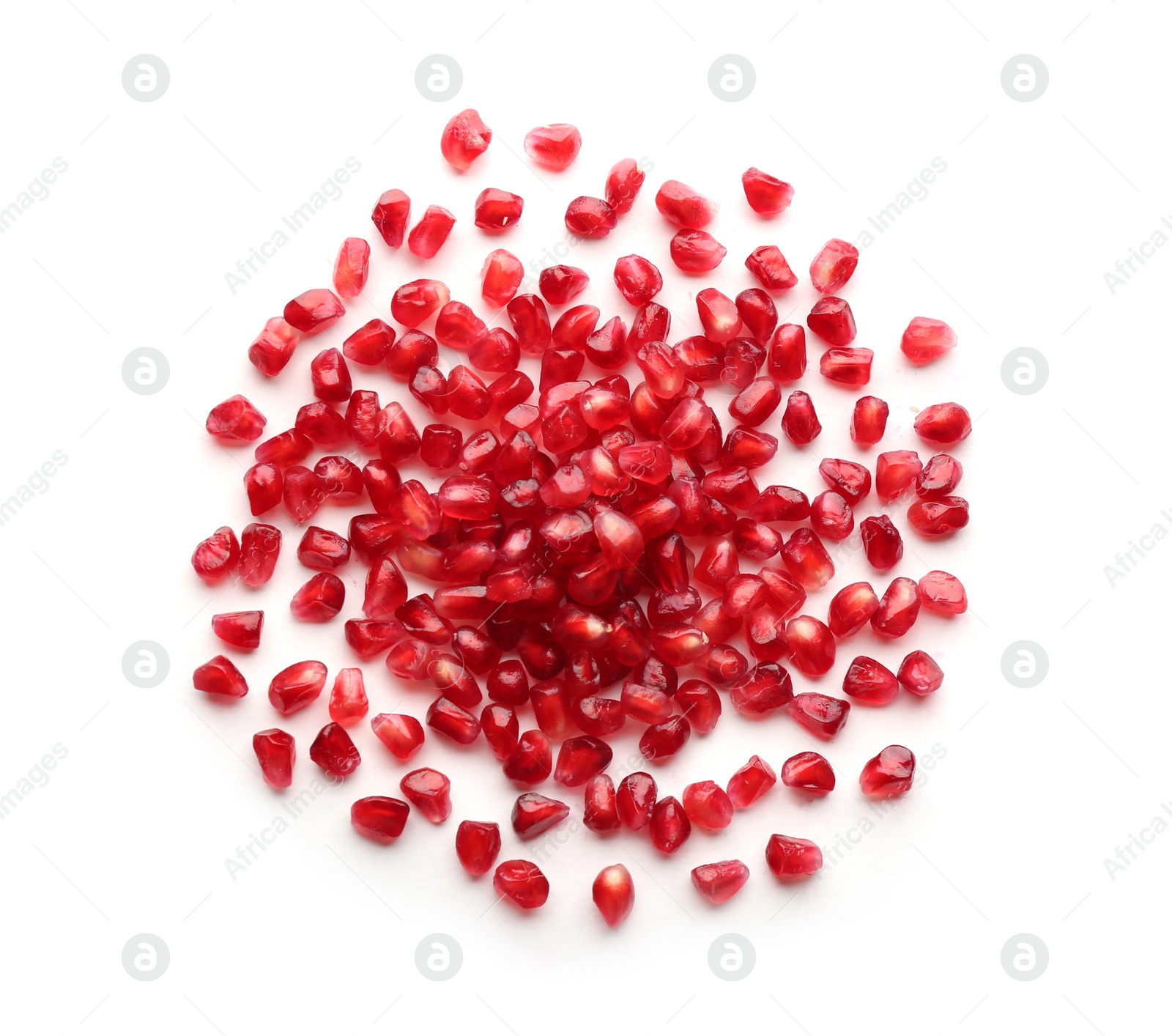 Photo of Pomegranate seeds on white background, top view. Delicious fruit