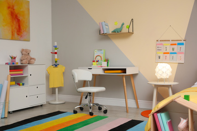 Stylish child room interior with modern furniture