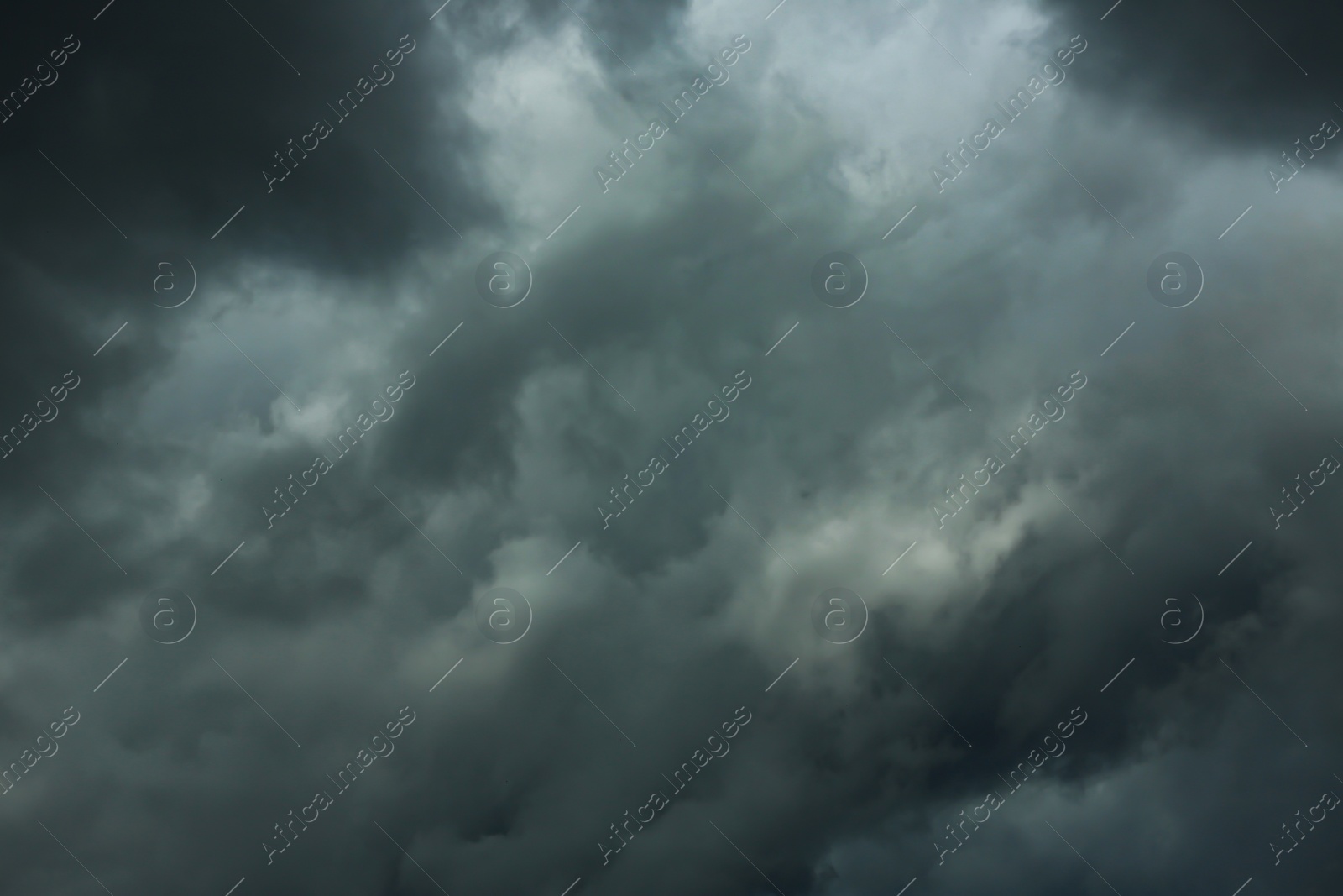 Photo of Sky with heavy rainy clouds on grey day